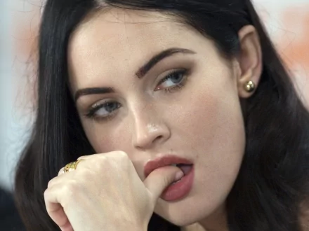 A stunning HD desktop wallpaper featuring celebrity Megan Fox, showcasing her captivating expression and elegant style.