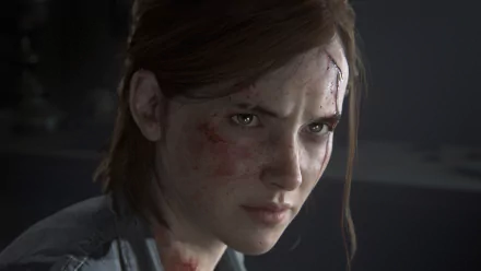 HD desktop wallpaper of Ellie from The Last of Us Part II video game, showcasing her intense expression with dirt and cuts on her face.