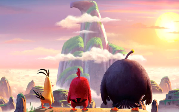 HD desktop wallpaper featuring characters from The Angry Birds Movie gazing towards a majestic, cloud-covered mountain at sunset.