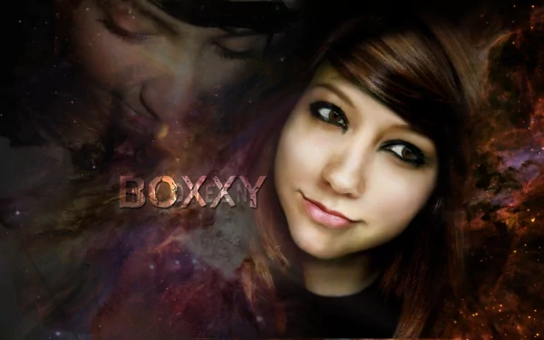 HD PC desktop wallpaper featuring a woman with dark hair and expressive eyes, set against a cosmic background with the word BOXXY integrated into the design.