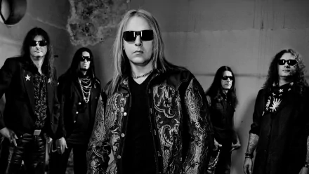 Black-and-white HD desktop wallpaper of the heavy metal/power metal band Helloween. The band members are standing in a cool, confident pose, all wearing dark clothing and sunglasses.