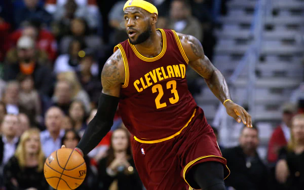 HD desktop wallpaper featuring a focused basketball player in a Cleveland Cavaliers #23 jersey dribbling during a game.