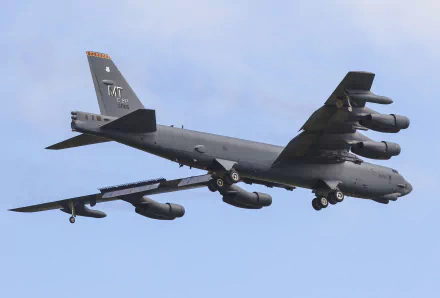 A Boeing B-52 Stratofortress bomber aircraft in flight, showcasing its military air force design against a clear sky, captured in 4K Ultra HD quality.