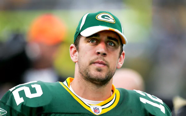 HD wallpaper featuring a focused Aaron Rodgers in a Green Bay Packers uniform as a desktop background.