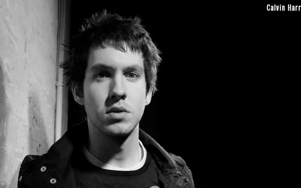 A monochrome HD desktop wallpaper featuring a portrait of a man with the text Calvin Harris in the corner.
