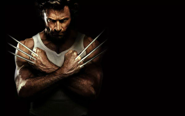 HD desktop wallpaper from the movie X-Men Origins: Wolverine, featuring Wolverine with his claws crossed against a dark background.