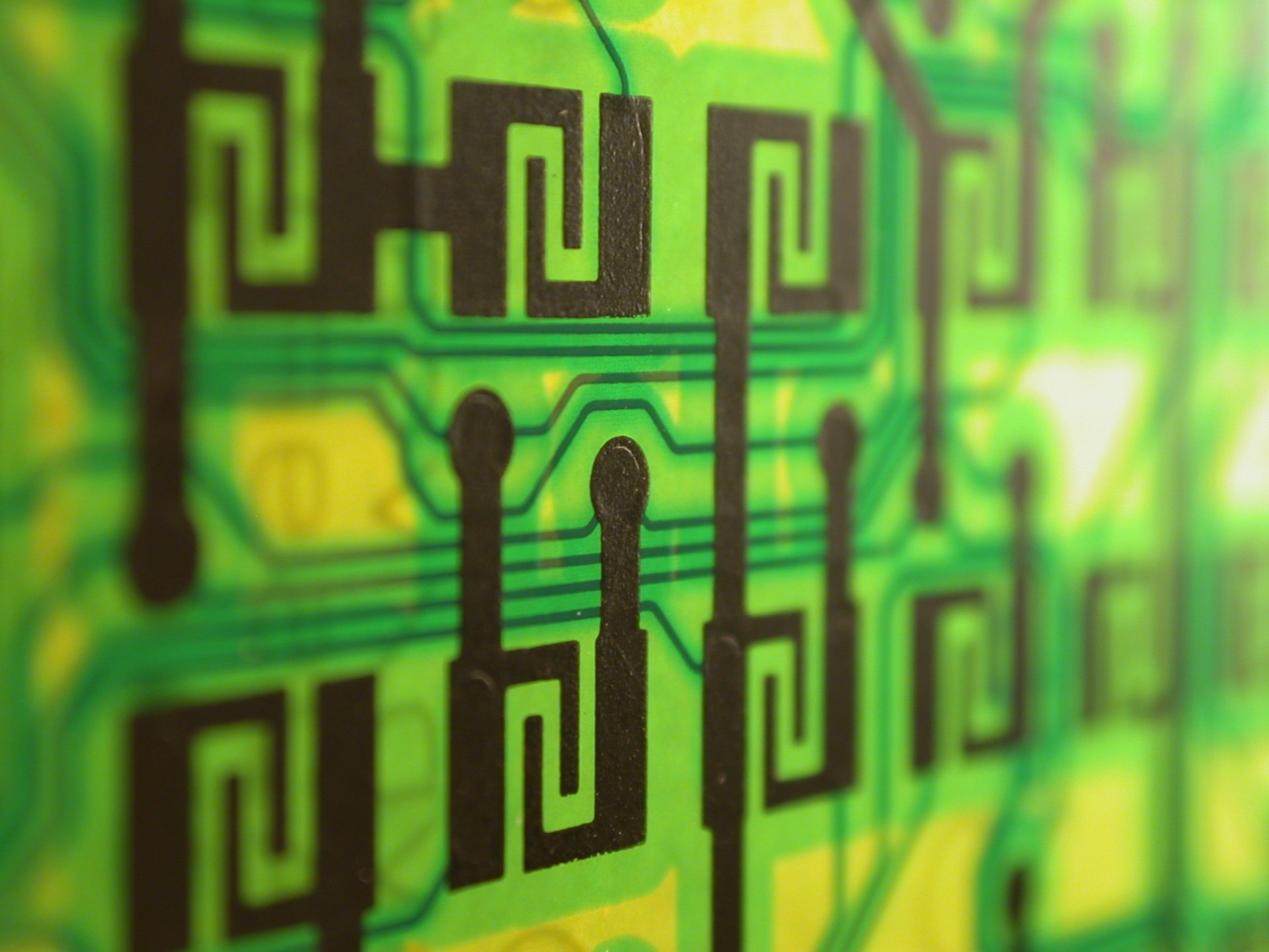 Close-up of a vibrant green circuit board design, showcasing intricate technology patterns. This HD image serves as a striking desktop wallpaper and background.