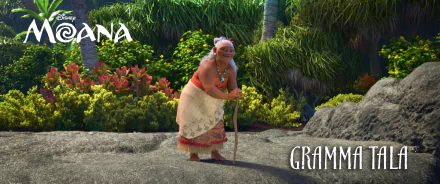 Gramma Tala from the movie Moana is featured in this HD desktop wallpaper, set against a lush tropical background.