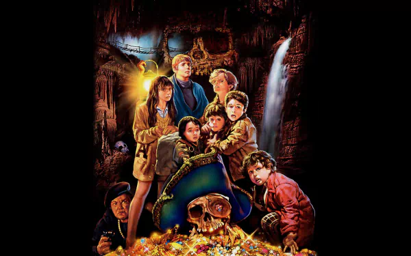 HD desktop wallpaper featuring the main characters of the movie The Goonies surrounded by treasure in a dark, adventurous cave setting.