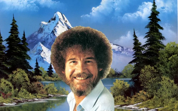 A serene landscape featuring a joyful man with a distinctive afro, set against mountains and trees, serves as an HD PC desktop wallpaper and background.