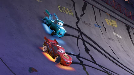 HD PC desktop wallpaper from Cars Toons: Mater's Tall Tales showing Lightning McQueen and Mater racing along a cracked concrete wall, leaving streaks of tire marks and motion blur.