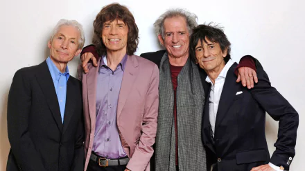 HD desktop wallpaper featuring the iconic rock band The Rolling Stones posing together against a white background.