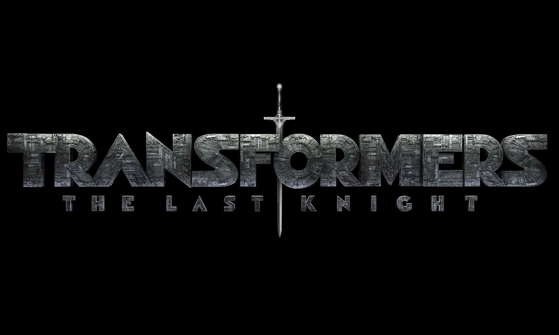 HD desktop wallpaper featuring the movie logo of Transformers: The Last Knight with a sword integrated into the text, set against a black background.