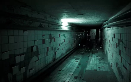 Eerie dark tunnel with broken tiled walls, dimly lit by a single light. The atmosphere is creepy, creating a chilling HD desktop wallpaper and background.