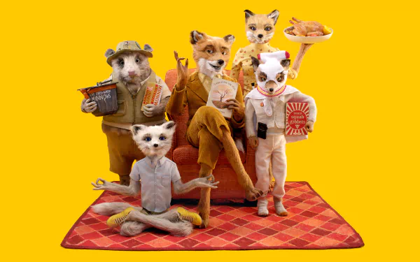 HD PC desktop wallpaper from the movie Fantastic Mr. Fox: Mr. Fox with his family and friends posed on a red picnic blanket against a bright yellow background.