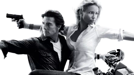 Black and white HD wallpaper featuring Tom Cruise and Cameron Diaz in an action pose from the movie Knight and Day.
