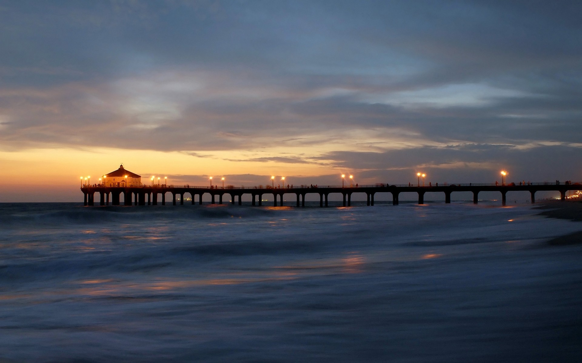 Sunset skyline with pier and beach in the light