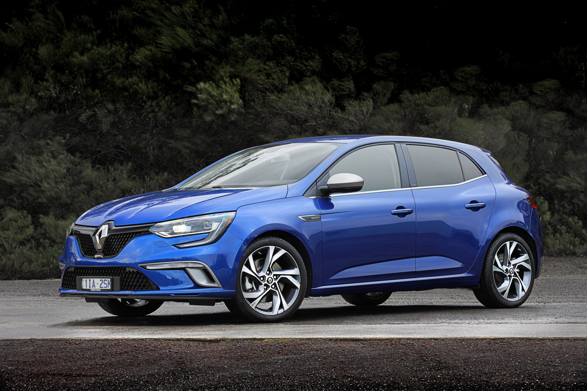 Blue Renault Megane hatchback car (vehicle) parked by a forest — crisp 4K Ultra HD PC Desktop Wallpaper and Background.
