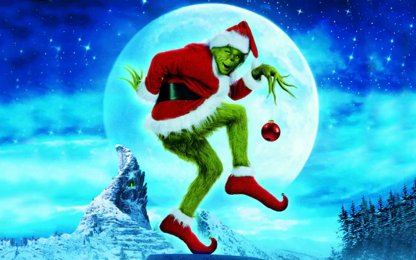 HD PC desktop wallpaper featuring the Grinch from the movie How the Grinch Stole Christmas in a Santa outfit, holding an ornament against a full moon and snowy landscape.