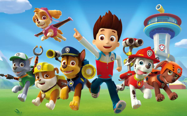 Colorful HD wallpaper featuring characters from the cartoon TV show Paw Patrol, showcasing a young boy and various playful dogs in a vibrant landscape.