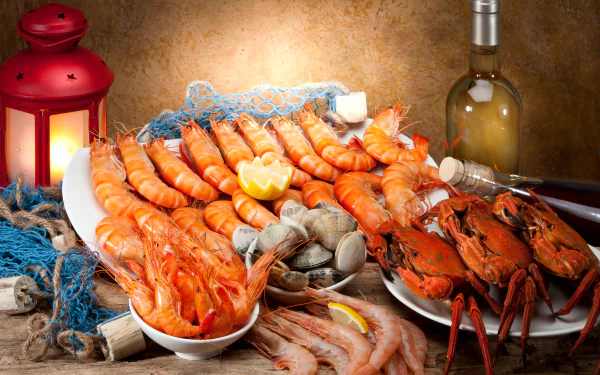 4K Ultra HD PC desktop wallpaper and background: lantern-lit seafood spread of shrimp, prawns, clams, crab and lobster on a rustic table with lemon and a bottle of white wine.
