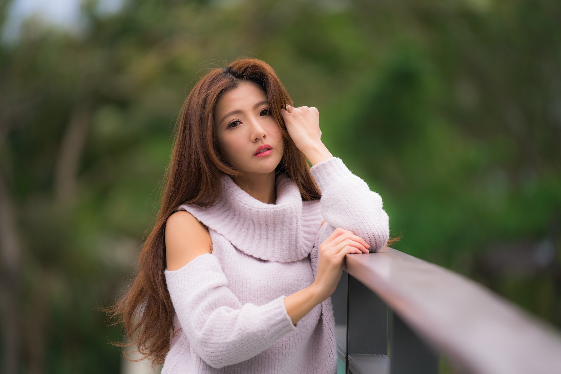 Portrait of an Asian brunette woman wearing lipstick, captured with a shallow depth of field in 8K Ultra HD quality for a PC desktop wallpaper background.