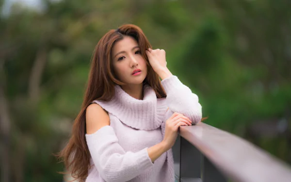 Portrait of an Asian brunette woman wearing lipstick, captured with a shallow depth of field in 8K Ultra HD quality for a PC desktop wallpaper background.
