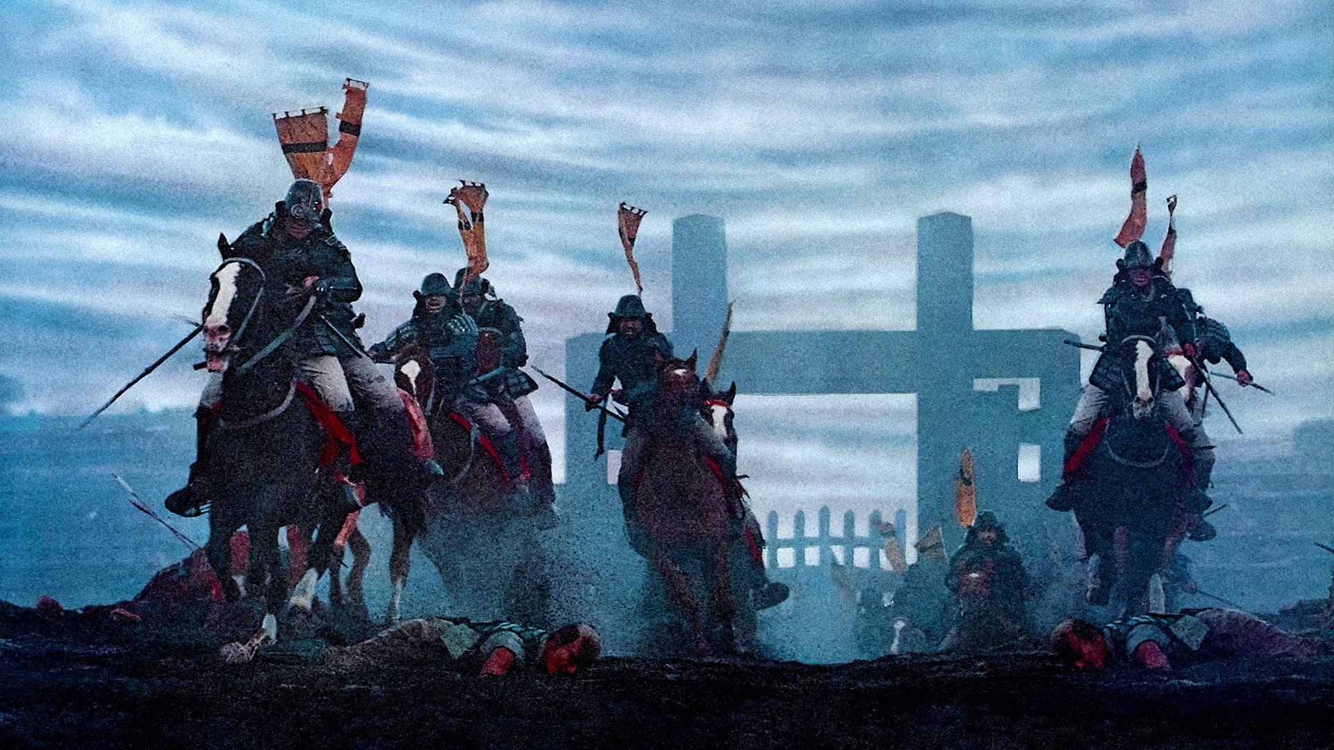 HD PC desktop wallpaper and background: scene from the movie Ran—armored samurai on horseback charging across a misty battlefield toward a torii gate, banners whipping in the wind.