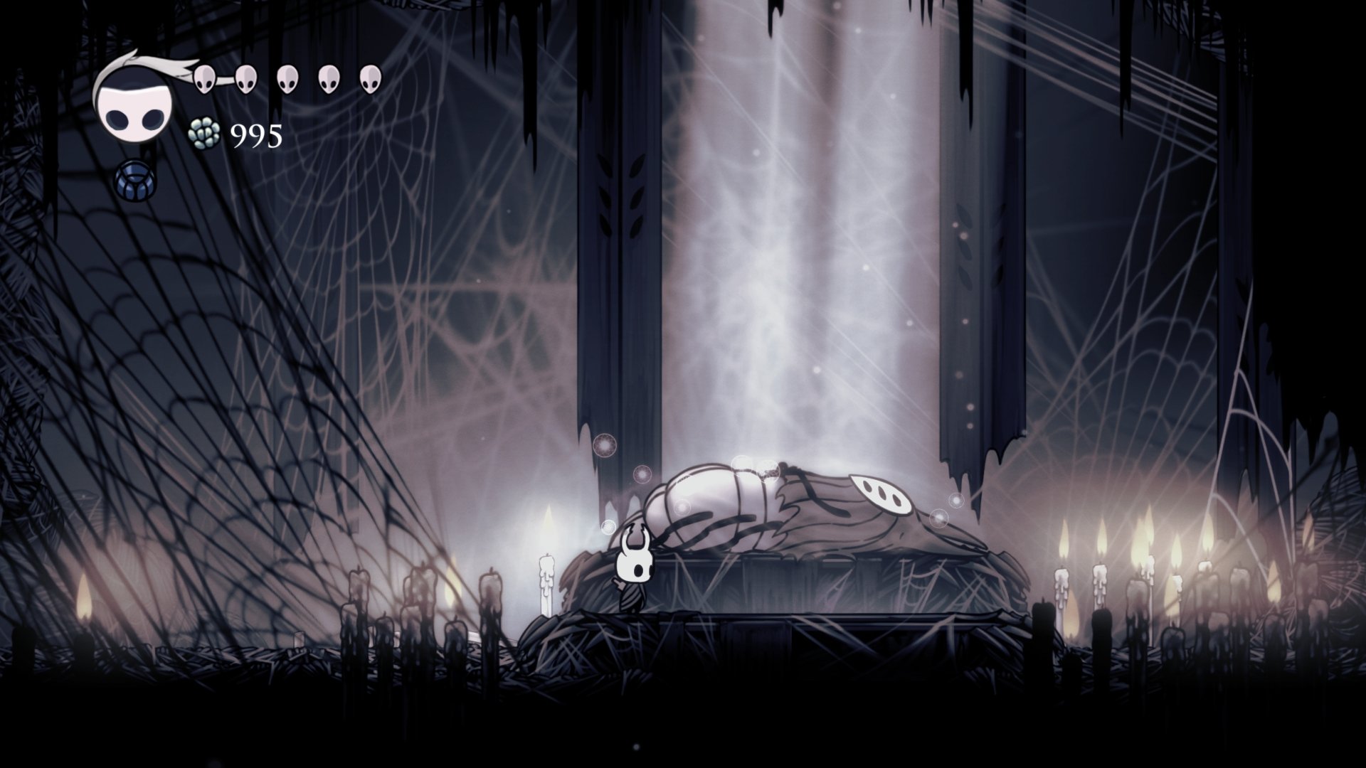 Hollow Knight video game 4K Ultra HD PC desktop wallpaper: silhouetted knight beside a fallen, mantled figure bathed in a shaft of light inside a gothic, candlelit chamber.