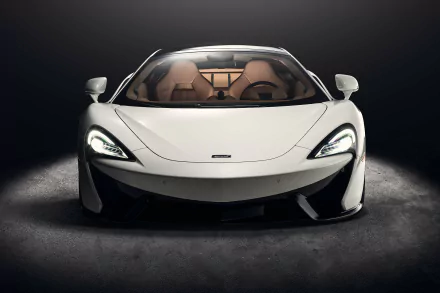White McLaren 570GT supercar showcased as an HD desktop wallpaper, highlighting its sleek design and sporty elegance in a dark, minimalistic setting.