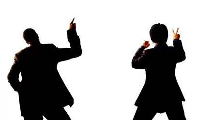 A dynamic HD desktop wallpaper featuring silhouettes of Chris Tucker and Jackie Chan from the movie Rush Hour 2, striking playful poses against a white background.