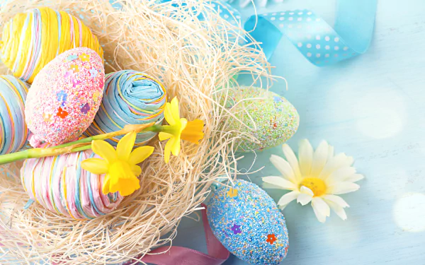 Colorful Easter eggs nestled in straw with vibrant flowers, captured in a bright 4K Ultra HD holiday-themed desktop wallpaper background.