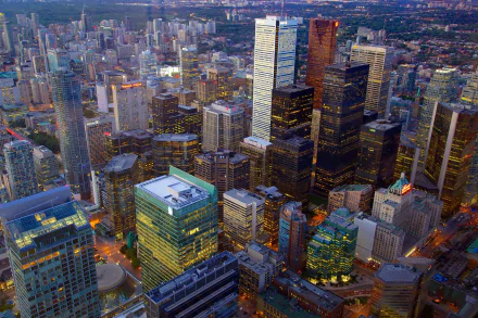 Aerial view of Toronto's skyline showcasing skyscrapers and city buildings in Canada, captured in stunning 4K Ultra HD quality for a vibrant desktop wallpaper.