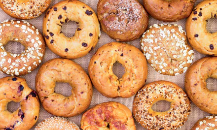 HD PC desktop wallpaper and background showing bread, food, bagel assortment: seeded, oat and topped bagels arranged on a burlap surface.