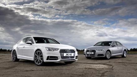 HD desktop wallpaper featuring two Audi A4 vehicles, one silver and one white, parked side by side under a dramatic cloudy sky.