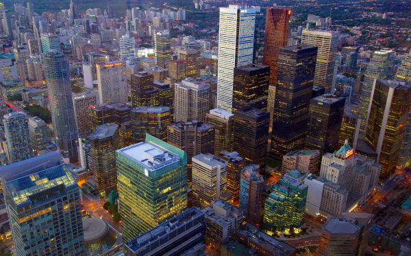 Aerial view of Toronto's skyline showcasing skyscrapers and city buildings in Canada, captured in stunning 4K Ultra HD quality for a vibrant desktop wallpaper.