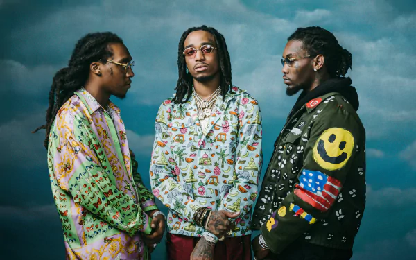 HD wallpaper featuring the hip-hop trio Migos posing confidently against a cloudy sky background.