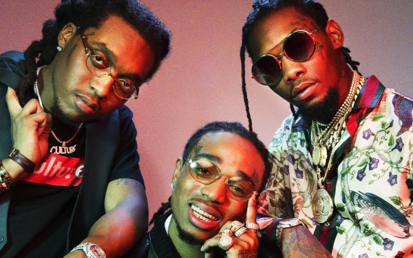 HD desktop wallpaper featuring the hip-hop trio Migos posing against a red background.