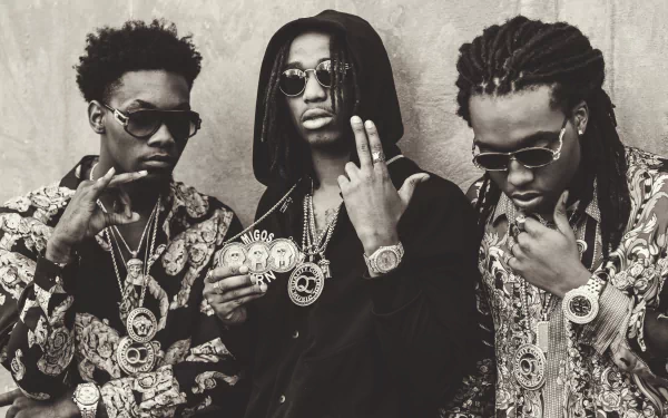 HD desktop wallpaper featuring three members of Migos posing confidently in matching patterned outfits.