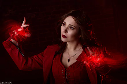 HD PC desktop wallpaper featuring a woman cosplaying as Scarlet Witch from Avengers, with glowing red magical effects around her hands against a dark background.