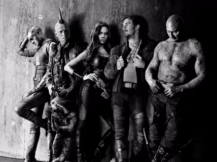 Black-and-white HD wallpaper featuring characters from Guardians of the Galaxy Vol. 2: Yondu, Gamora, Star-Lord, Drax, Rocket Raccoon, Michael Rooker, Chris Pratt, Nebula, and more cast members.