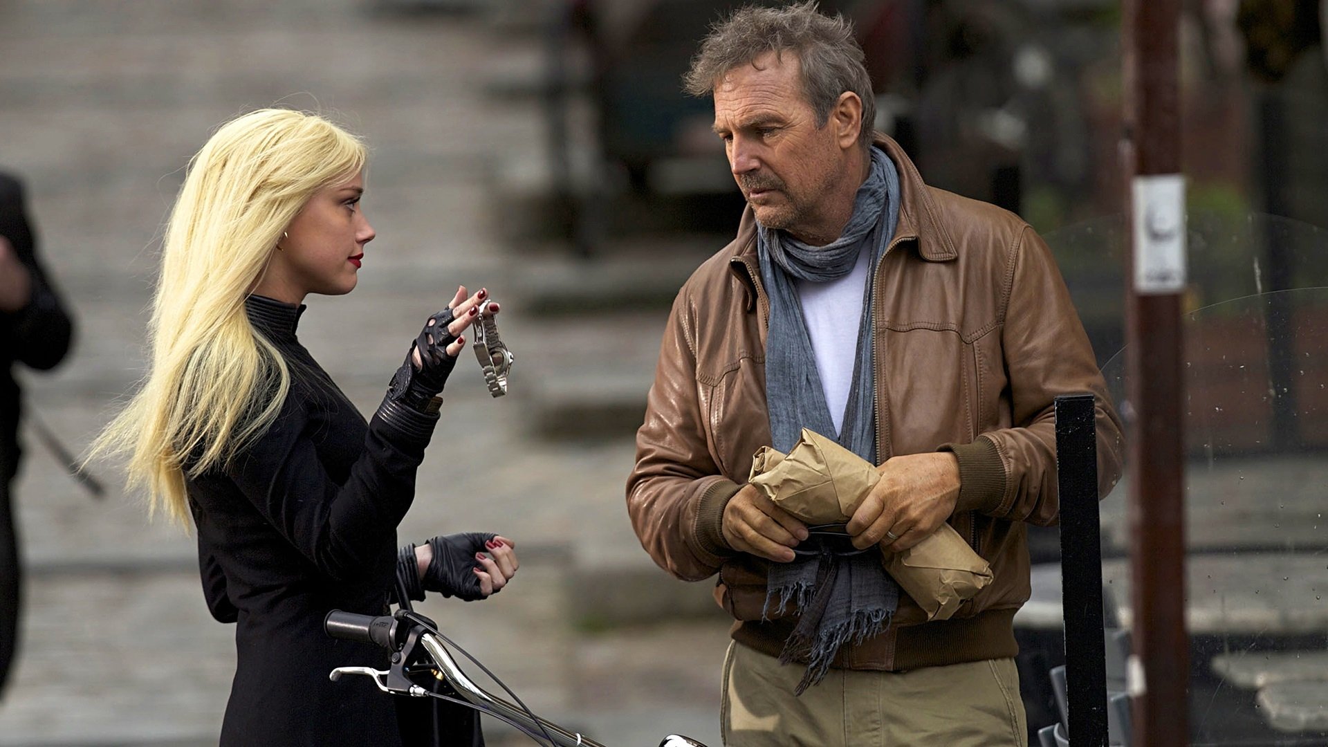 HD desktop wallpaper featuring Kevin Costner and Amber Heard in a scene from the movie Three Days to Kill.