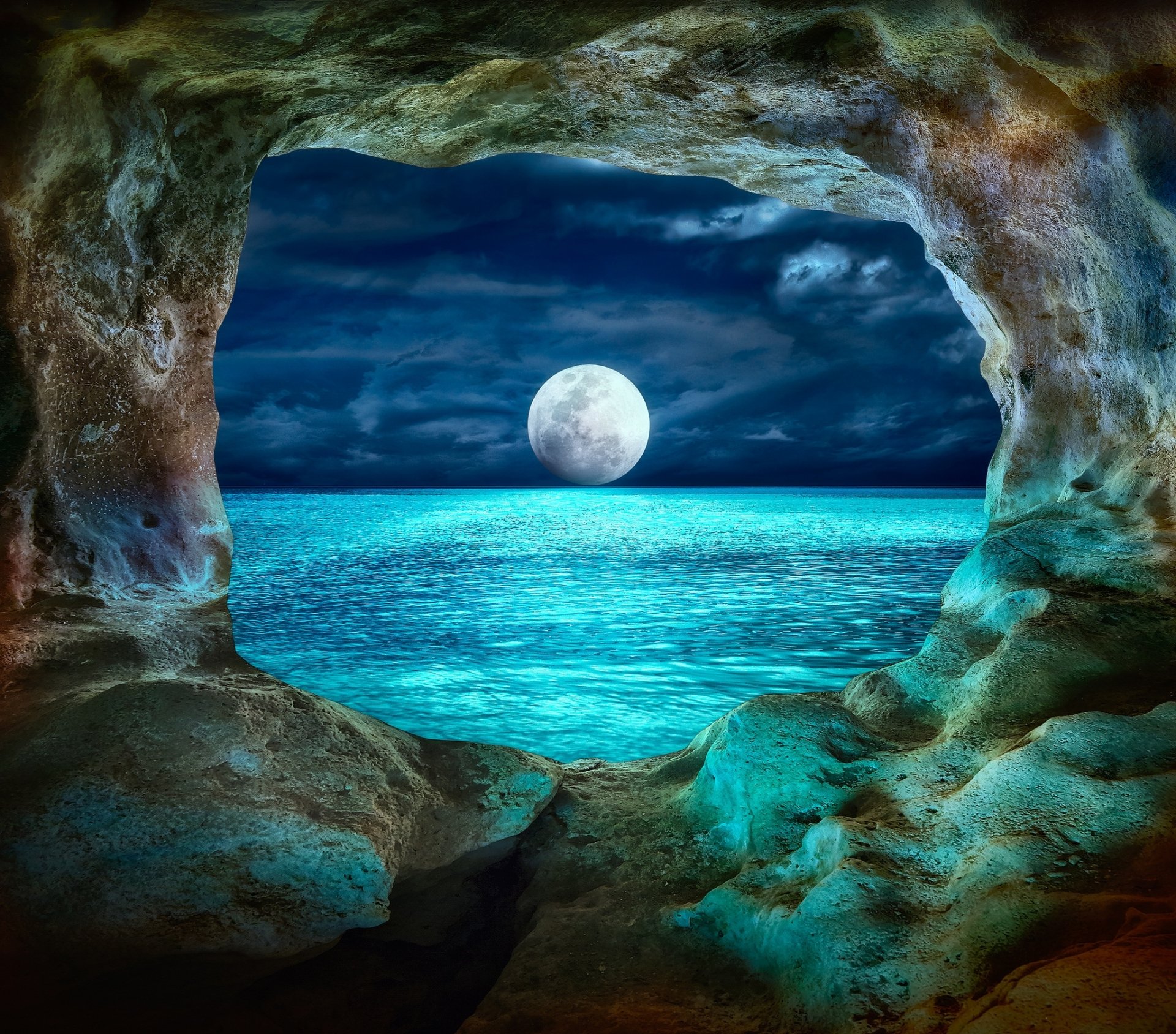 HD desktop wallpaper of a serene ocean view framed by a cave opening, with a full moon illuminating the water and adding to the natural beauty.