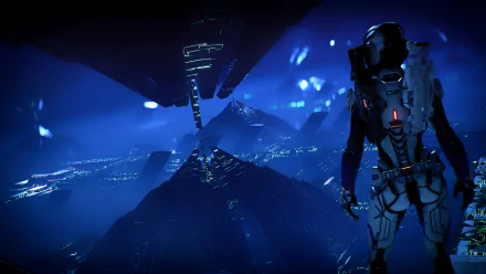 HD PC desktop wallpaper from Mass Effect: Andromeda featuring a blue-toned futuristic building with a character in a space suit in the foreground.