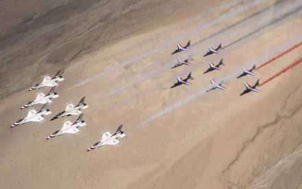 Aerial view of United States Air Force Thunderbirds and military jets in formation at an air show, leaving red, white, and blue smoke trails — 2K Quad HD desktop wallpaper.