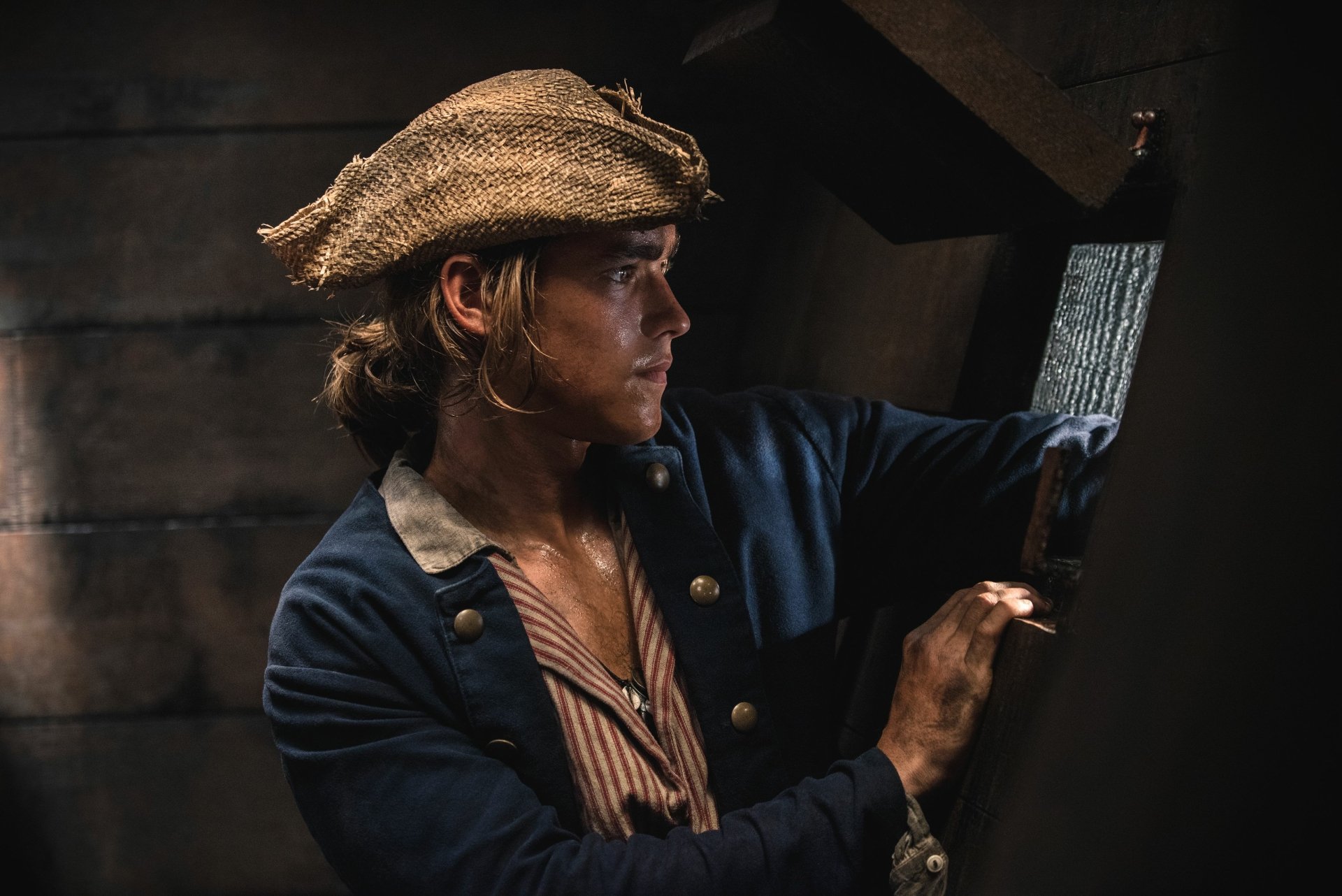 Brenton Thwaites as Henry Turner in a dramatic scene from Pirates of the Caribbean: Dead Men Tell No Tales, shown in 4K Ultra HD desktop wallpaper quality.