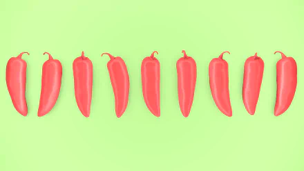 Minimalist artistic 4K Ultra HD PC wallpaper of evenly spaced red peppers on a bright green background, highlighting vibrant color contrasts in a clean food-themed design.