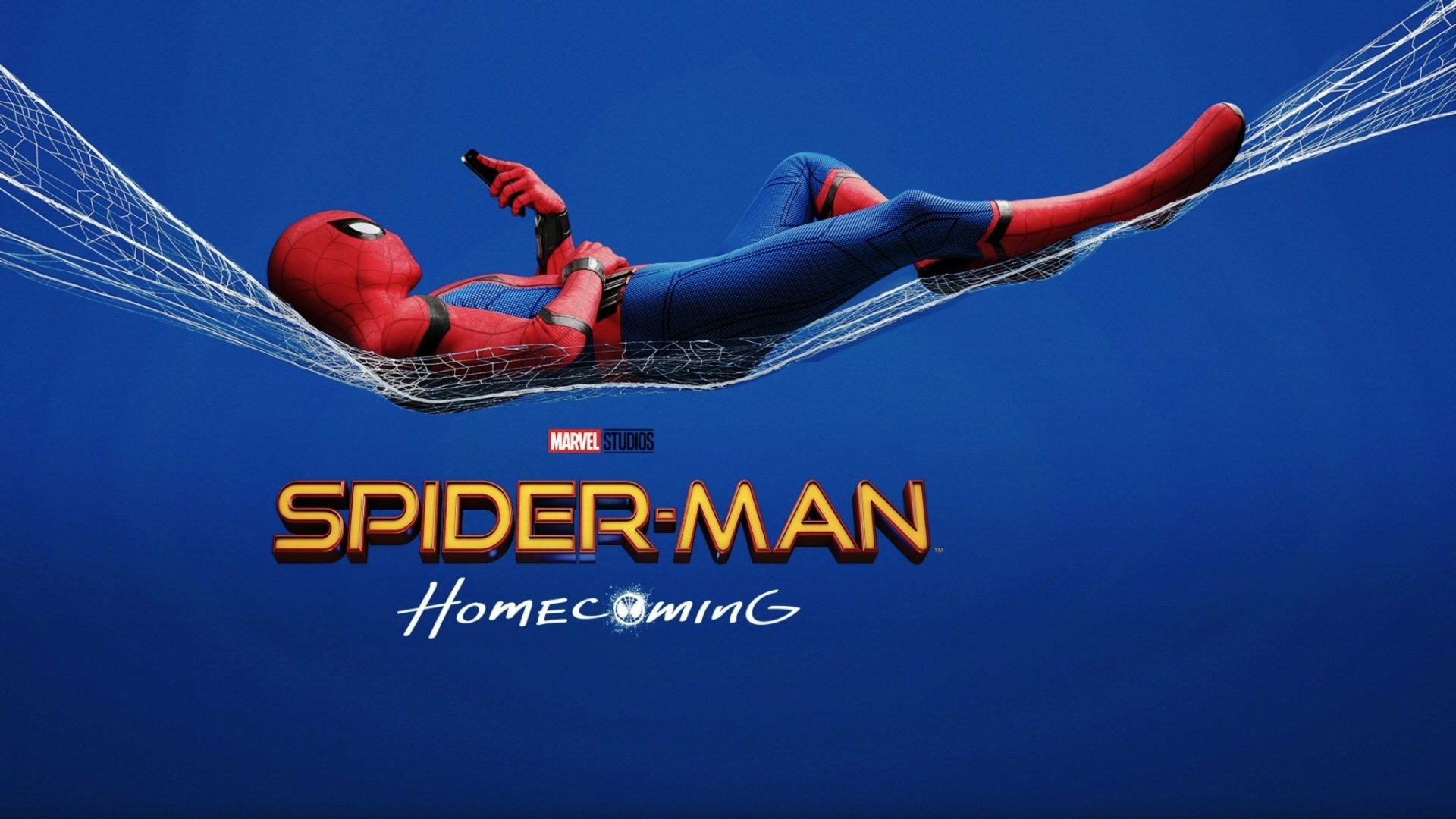 Spider-Man from the movie Spider-Man: Homecoming relaxes on a web against a blue background. This HD desktop wallpaper showcases the hero in his iconic suit.