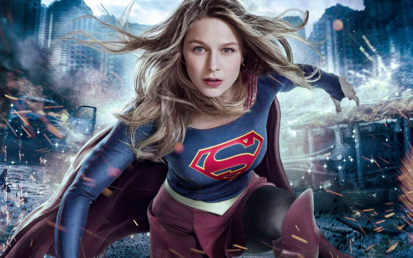 HD desktop wallpaper featuring Melissa Benoist as Supergirl in action from the TV show Supergirl, with a dramatic, cityscape background.