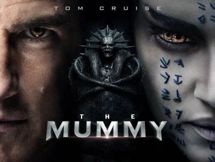 HD desktop wallpaper featuring Tom Cruise and Sofia Boutella from the movie The Mummy (2017), showcasing intense close-ups of their faces with ancient Egyptian symbols and the film's title in the center.